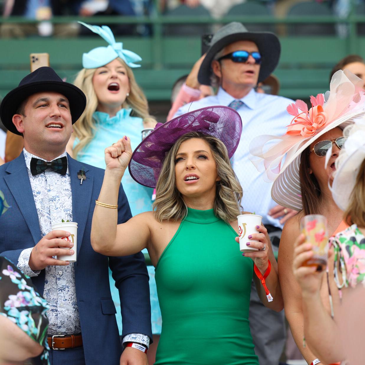 Woman cheers in Section 124 during race.JPG